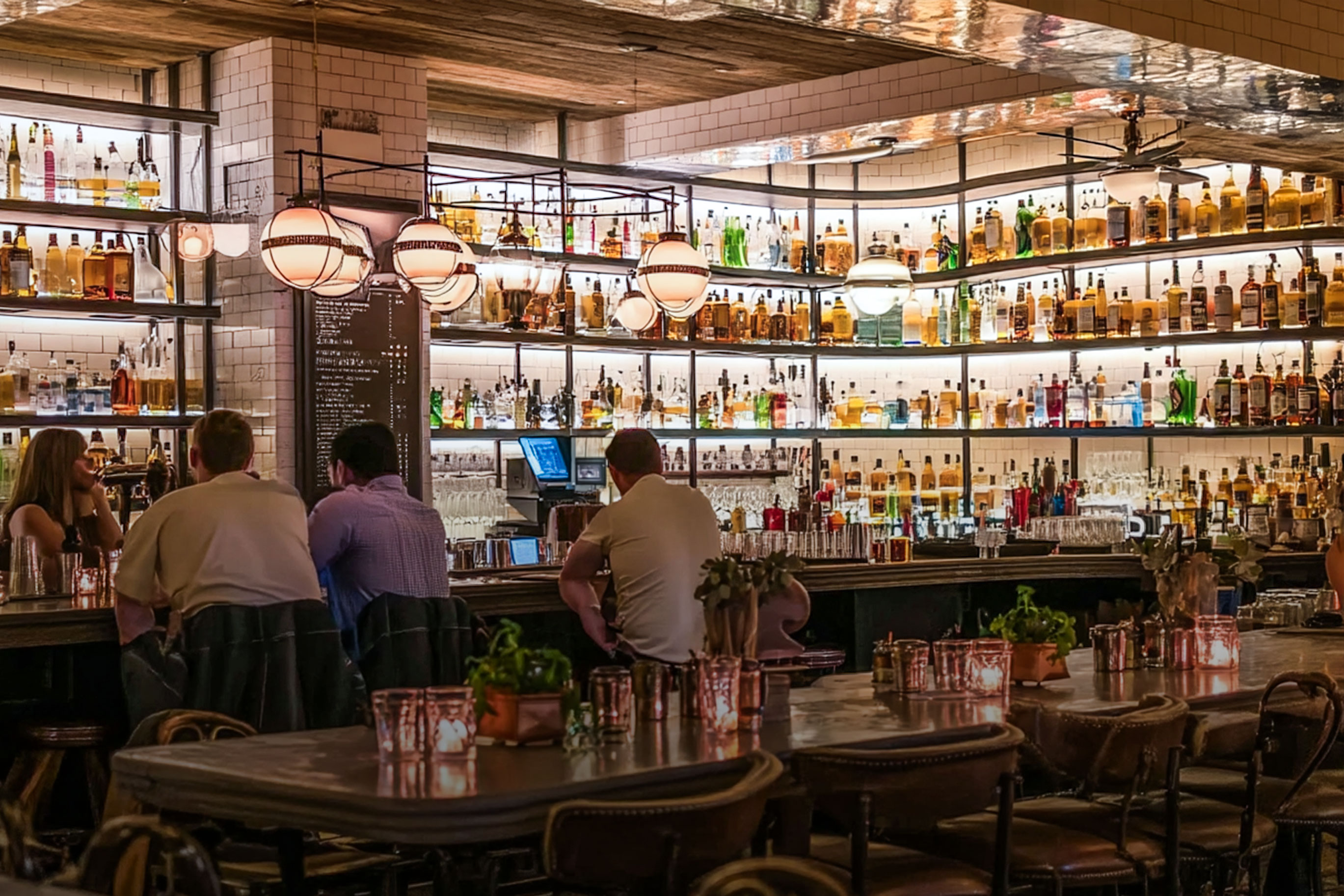 In-house Spirits people in a bar enjoying spirits